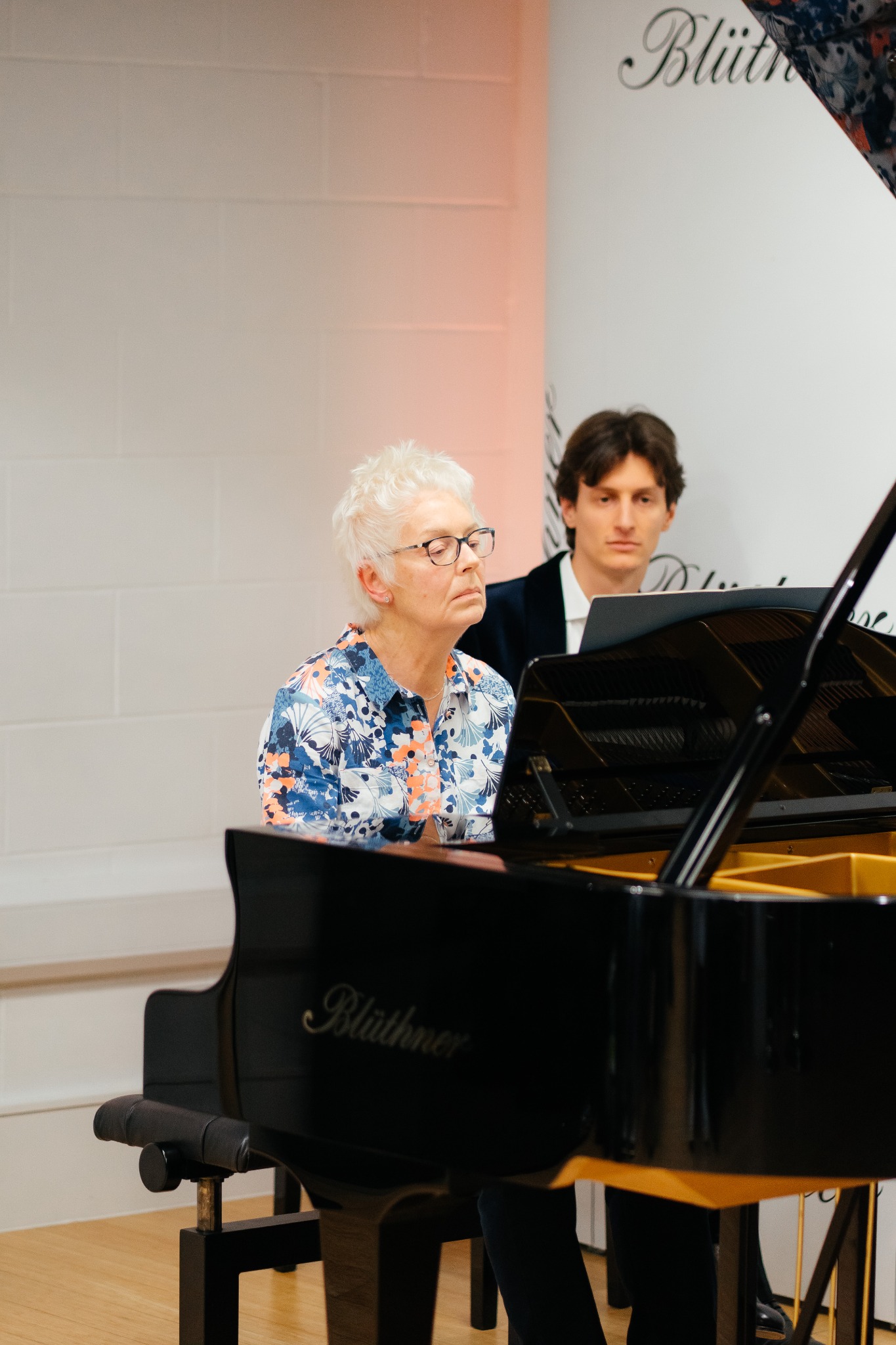 Adult pianist performing at a London Piano Practice recital
