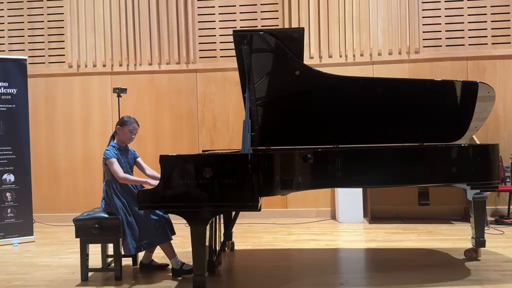 Audrey performing at the piano