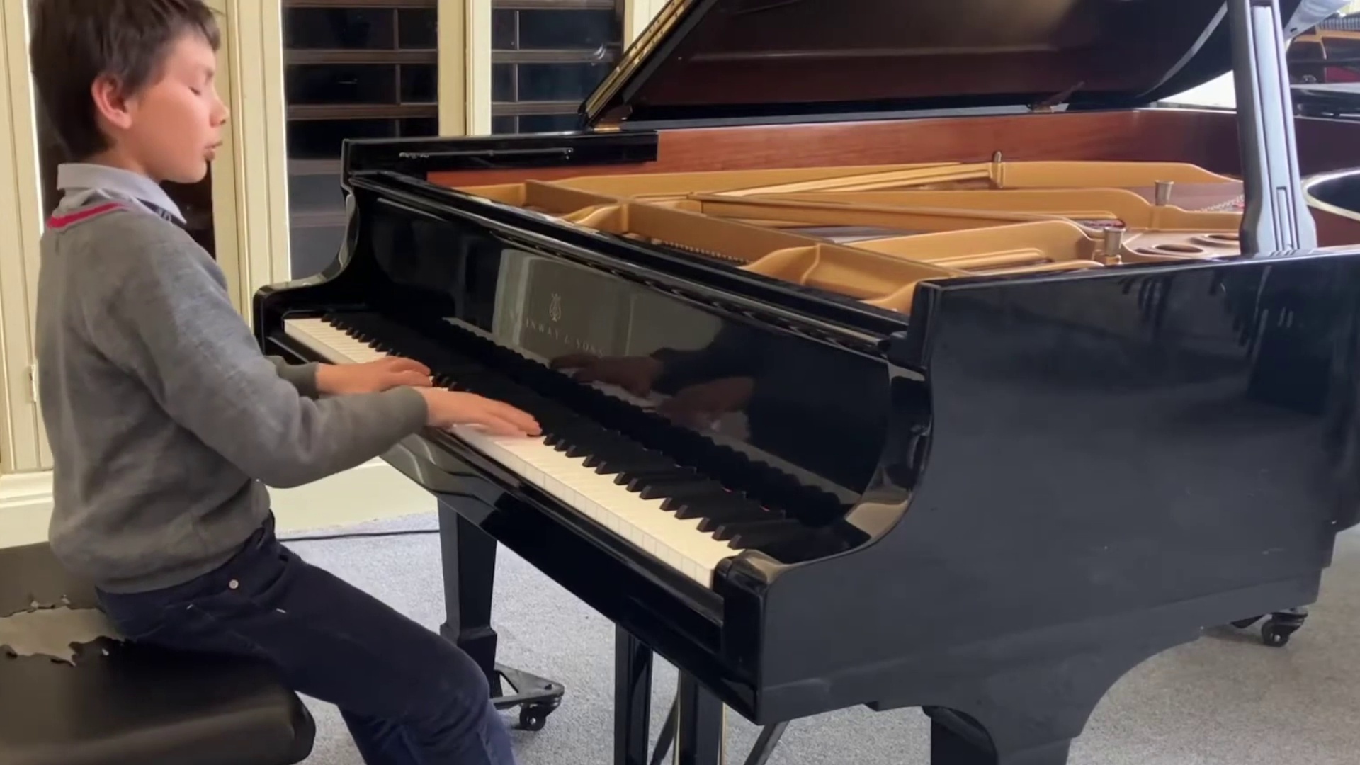 Lucas performing Schumann at the piano