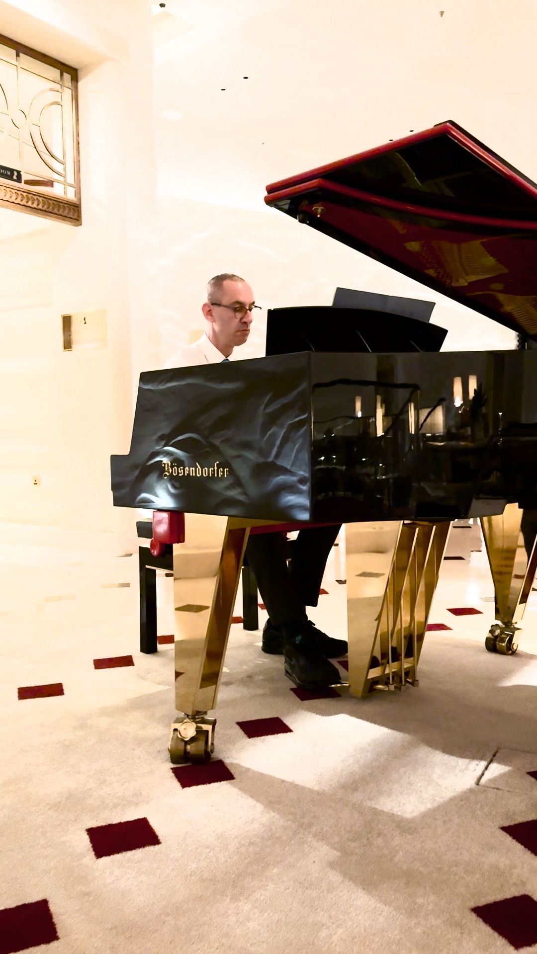 Stuart performing at the piano